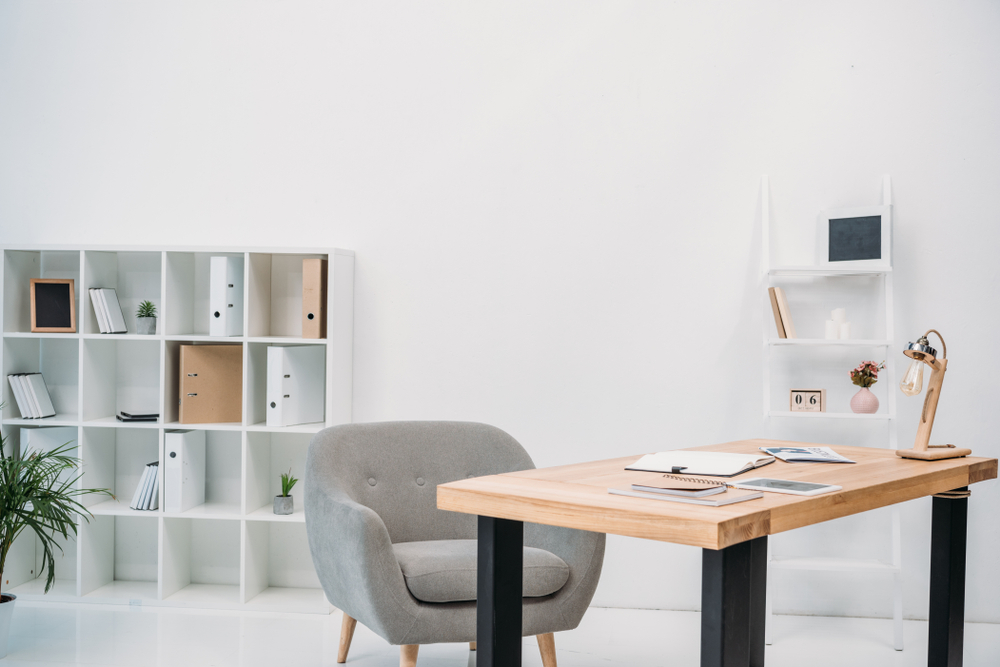 modern office interior with papers and digital tablet on table